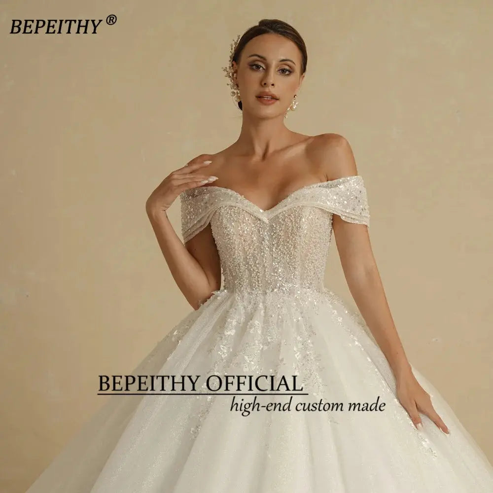 BEPEITHY Ivory Beading Princess Wedding Dresses 2022 For Bride Off TheSPECIFICATIONSBrand Name: BEPEITHYStyle: ExquisiteNeckline: SWEETHEARTSleeve Length(cm): sleevelessTrain: Sweep/ Brush TrainOrigin: Mainland ChinaCN: AnhuiDresses LeJohnny TirakJohnny TirakShoulder Sleeveless Women Glitter Ball Bridal Gown Robes