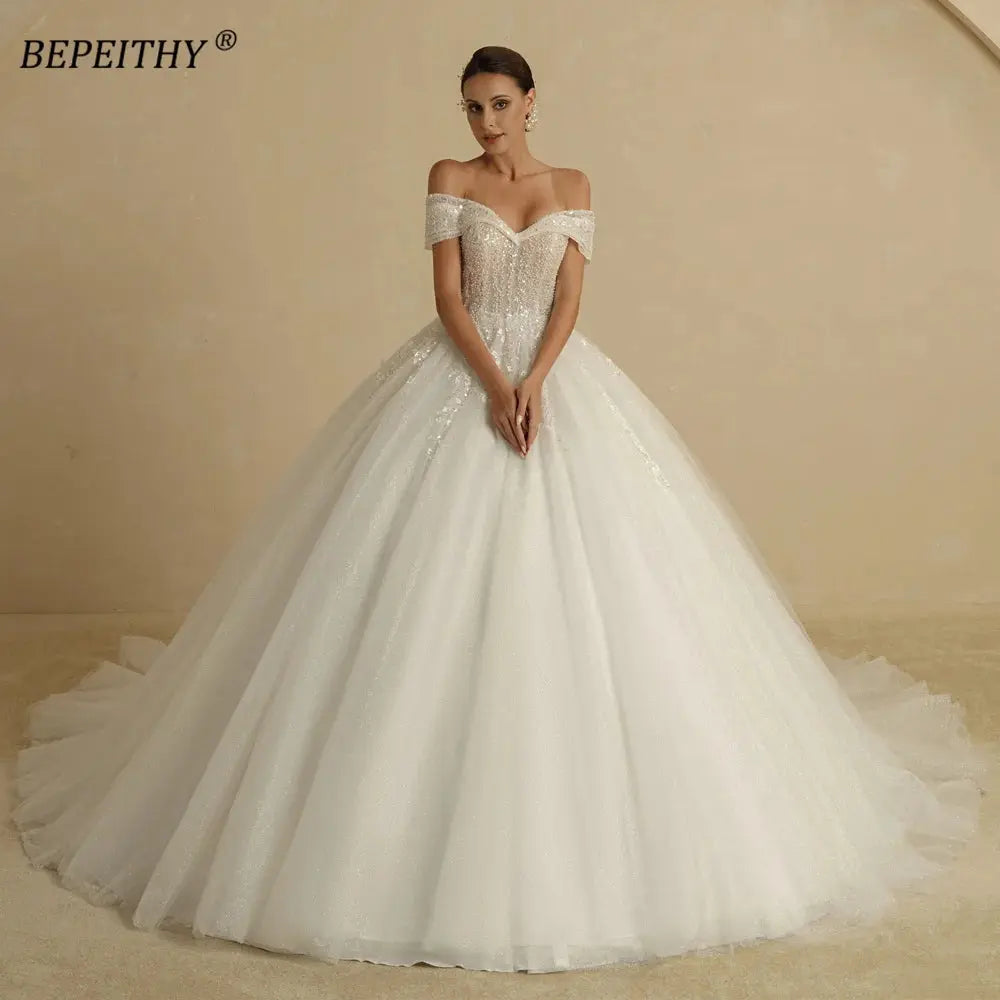 BEPEITHY Ivory Beading Princess Wedding Dresses 2022 For Bride Off TheSPECIFICATIONSBrand Name: BEPEITHYStyle: ExquisiteNeckline: SWEETHEARTSleeve Length(cm): sleevelessTrain: Sweep/ Brush TrainOrigin: Mainland ChinaCN: AnhuiDresses LeJohnny TirakJohnny TirakShoulder Sleeveless Women Glitter Ball Bridal Gown Robes