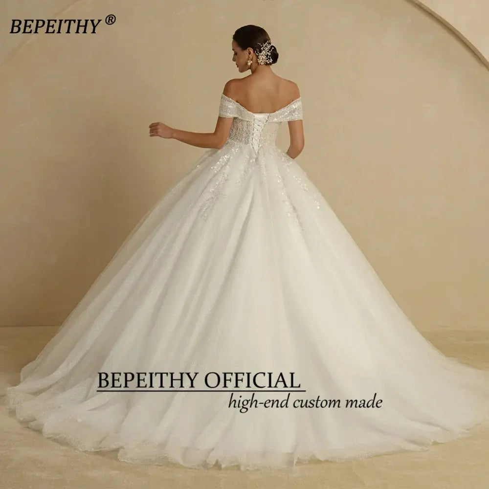 BEPEITHY Ivory Beading Princess Wedding Dresses 2022 For Bride Off TheSPECIFICATIONSBrand Name: BEPEITHYStyle: ExquisiteNeckline: SWEETHEARTSleeve Length(cm): sleevelessTrain: Sweep/ Brush TrainOrigin: Mainland ChinaCN: AnhuiDresses LeJohnny TirakJohnny TirakShoulder Sleeveless Women Glitter Ball Bridal Gown Robes