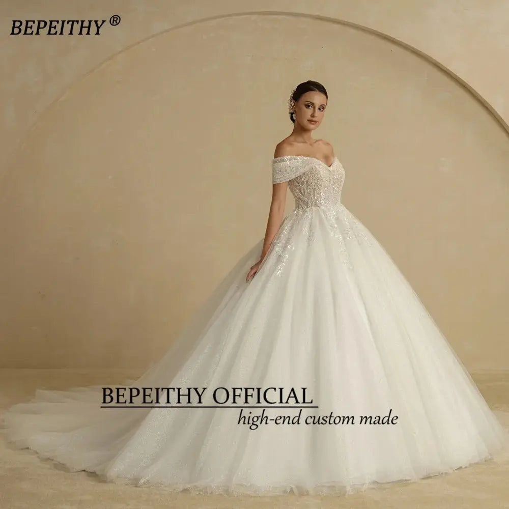 BEPEITHY Ivory Beading Princess Wedding Dresses 2022 For Bride Off TheSPECIFICATIONSBrand Name: BEPEITHYStyle: ExquisiteNeckline: SWEETHEARTSleeve Length(cm): sleevelessTrain: Sweep/ Brush TrainOrigin: Mainland ChinaCN: AnhuiDresses LeJohnny TirakJohnny TirakShoulder Sleeveless Women Glitter Ball Bridal Gown Robes