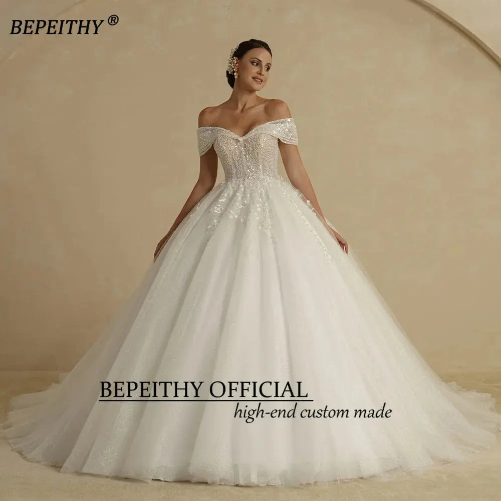 BEPEITHY Ivory Beading Princess Wedding Dresses 2022 For Bride Off TheSPECIFICATIONSBrand Name: BEPEITHYStyle: ExquisiteNeckline: SWEETHEARTSleeve Length(cm): sleevelessTrain: Sweep/ Brush TrainOrigin: Mainland ChinaCN: AnhuiDresses LeJohnny TirakJohnny TirakShoulder Sleeveless Women Glitter Ball Bridal Gown Robes