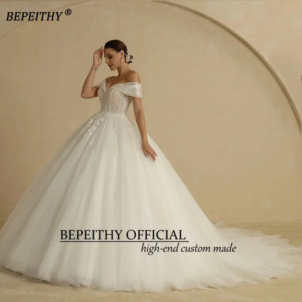 BEPEITHY Ivory Beading Princess Wedding Dresses 2022 For Bride Off TheSPECIFICATIONSBrand Name: BEPEITHYStyle: ExquisiteNeckline: SWEETHEARTSleeve Length(cm): sleevelessTrain: Sweep/ Brush TrainOrigin: Mainland ChinaCN: AnhuiDresses LeJohnny TirakJohnny TirakShoulder Sleeveless Women Glitter Ball Bridal Gown Robes